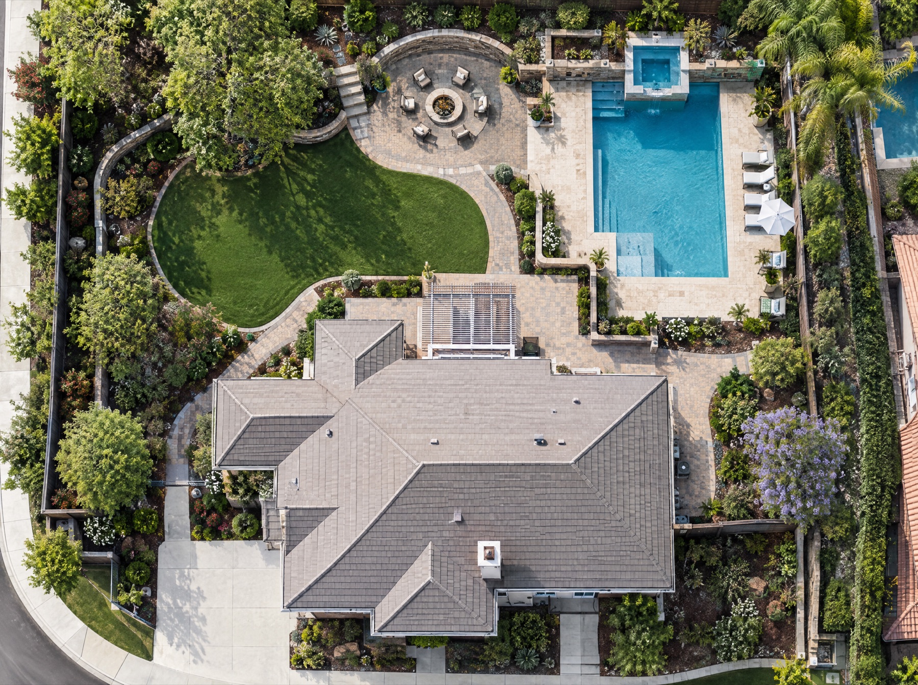 Aerial view of a fully landscaped residential property